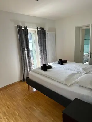 Ein Bett oder Betten in einem Zimmer der Unterkunft Interlaken Best View Deluxe Apartment
