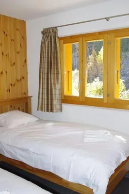 Ein Bett oder Betten in einem Zimmer der Unterkunft Chalet Mille Étoiles