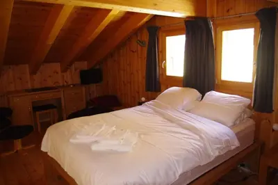 Ein Bett oder Betten in einem Zimmer der Unterkunft Chalet Mille Étoiles