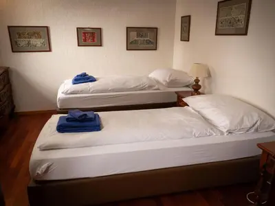 Ein Bett oder Betten in einem Zimmer der Unterkunft Apartment Chalet Turquino - Apartment Adlerhorst by Interhome