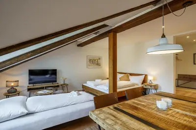 Ein Bett oder Betten in einem Zimmer der Unterkunft Heart of Interlaken Apartments