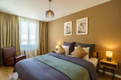 Ein Bett oder Betten in einem Zimmer der Unterkunft Heart of Interlaken Apartments