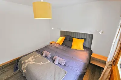 Ein Bett oder Betten in einem Zimmer der Unterkunft Magnifique appartement au coeur des 4 Vallées