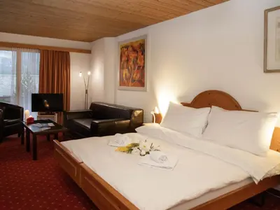 Ein Bett oder Betten in einem Zimmer der Unterkunft Apartment Chalet Abendrot apARTments-18 by Interhome