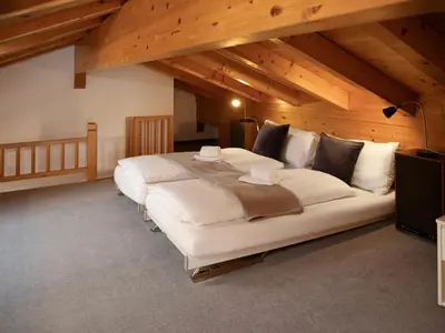 Ein Bett oder Betten in einem Zimmer der Unterkunft Apartment Chalet Abendrot apARTments-19 by Interhome