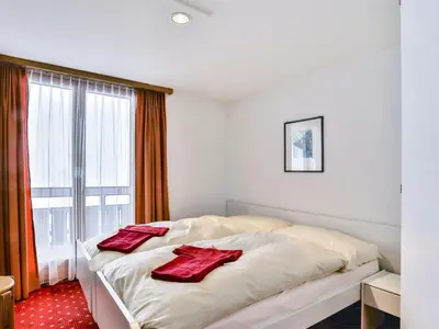 Ein Bett oder Betten in einem Zimmer der Unterkunft Apartment Chalet Abendrot apARTments-23 by Interhome