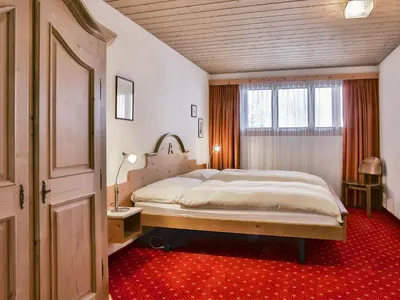 Ein Bett oder Betten in einem Zimmer der Unterkunft Apartment Chalet Abendrot apARTments-23 by Interhome