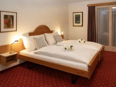Ein Bett oder Betten in einem Zimmer der Unterkunft Apartment Chalet Abendrot apARTments-24 by Interhome