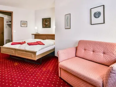 Ein Bett oder Betten in einem Zimmer der Unterkunft Apartment Chalet Abendrot apARTments-26 by Interhome
