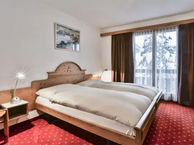 Ein Bett oder Betten in einem Zimmer der Unterkunft Apartment Chalet Abendrot apARTments-26 by Interhome