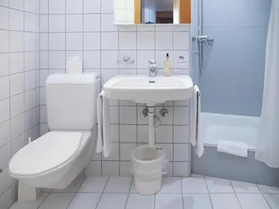 Ein Badezimmer in der Unterkunft Apartment Chalet Abendrot apARTments-28 by Interhome