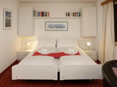 Ein Bett oder Betten in einem Zimmer der Unterkunft Apartment Chalet Abendrot apARTments-6 by Interhome