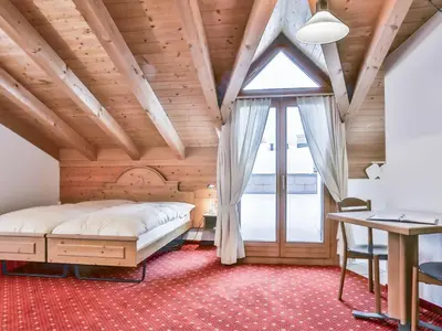Ein Bett oder Betten in einem Zimmer der Unterkunft Apartment Chalet Abendrot apARTments-9 by Interhome