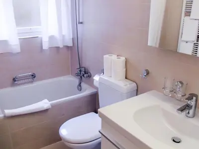 Ein Badezimmer in der Unterkunft Apartment Chalet Bodmisunne by Interhome
