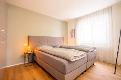 Ein Bett oder Betten in einem Zimmer der Unterkunft Valaisia 135