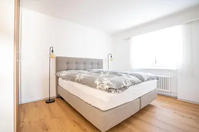 Ein Bett oder Betten in einem Zimmer der Unterkunft Valaisia 145