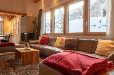Ein Sitzbereich in der Unterkunft Chalet A la Casa