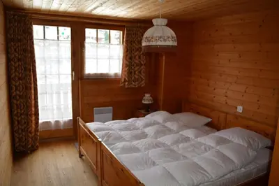 Ein Bett oder Betten in einem Zimmer der Unterkunft Magnifique chalet d'époque