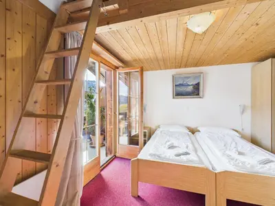 Ein Bett oder Betten in einem Zimmer der Unterkunft Hotel Wildbach Brienz