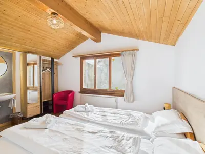 Ein Bett oder Betten in einem Zimmer der Unterkunft Hotel Wildbach Brienz