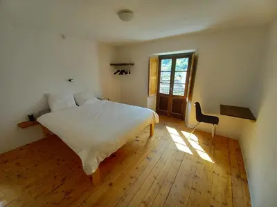 Ein Bett oder Betten in einem Zimmer der Unterkunft Casa Coerente Cavergno - Room 2
