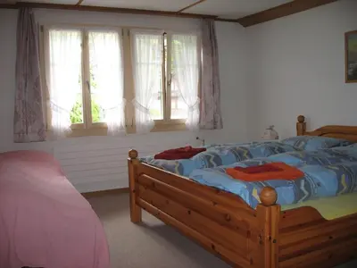 Ein Bett oder Betten in einem Zimmer der Unterkunft Chalet uf em Stutz 1