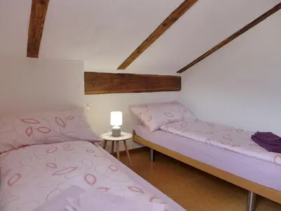 Ein Bett oder Betten in einem Zimmer der Unterkunft Chalet Tschingeli by Interhome