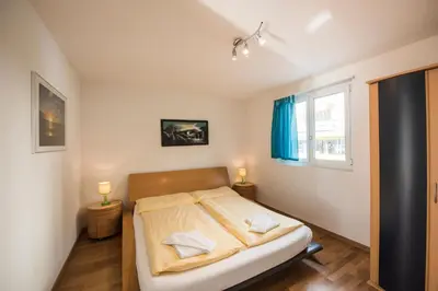 Ein Bett oder Betten in einem Zimmer der Unterkunft Alpenblick - Direct lake view