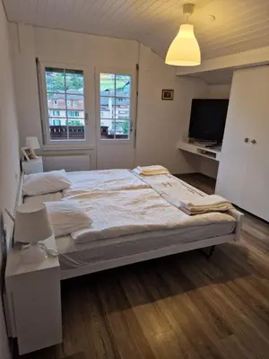 Ein Bett oder Betten in einem Zimmer der Unterkunft Hotel Chalet Bellerive