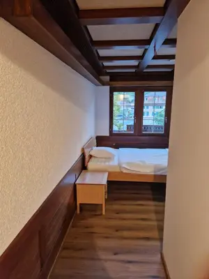 Ein Bett oder Betten in einem Zimmer der Unterkunft Hotel Chalet Bellerive