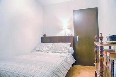 Ein Bett oder Betten in einem Zimmer der Unterkunft La Marmotte, au cœur du village de Crans, proche du télécabine Cry d'Er