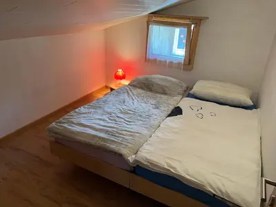 Ein Bett oder Betten in einem Zimmer der Unterkunft Historische Maisonette-Wohnung