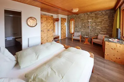 Ein Bett oder Betten in einem Zimmer der Unterkunft Hotel Waldhaus