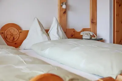 Ein Bett oder Betten in einem Zimmer der Unterkunft Hotel Waldhaus