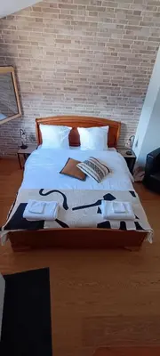 Ein Bett oder Betten in einem Zimmer der Unterkunft La Reine-des-prés