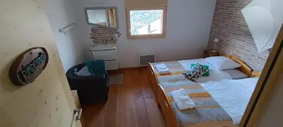 Ein Bett oder Betten in einem Zimmer der Unterkunft La Reine-des-prés