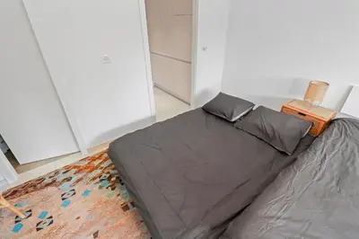 Ein Bett oder Betten in einem Zimmer der Unterkunft Studio paisible et chaleureux