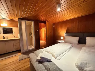 Ein Bett oder Betten in einem Zimmer der Unterkunft Alpina Appartment 2