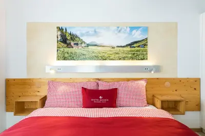 Ein Bett oder Betten in einem Zimmer der Unterkunft Berghotel Distelboden