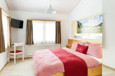 Ein Bett oder Betten in einem Zimmer der Unterkunft Berghotel Distelboden