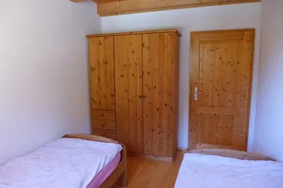 Ein Bett oder Betten in einem Zimmer der Unterkunft Wohnung mit 4 Schlafzimmer