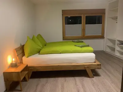 Ein Bett oder Betten in einem Zimmer der Unterkunft B&B Kalbermatter