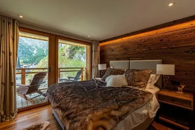 Ein Bett oder Betten in einem Zimmer der Unterkunft Sonnhalde II - Luxury Chalet