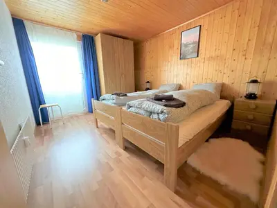 Ein Bett oder Betten in einem Zimmer der Unterkunft Ski-in, central and cosy in the Chalet Diana, free access to swimming pool