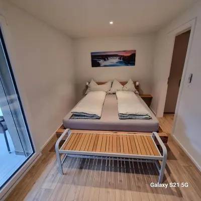 Ein Bett oder Betten in einem Zimmer der Unterkunft Mountain-Lake Apartment 2