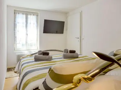 Ein Bett oder Betten in einem Zimmer der Unterkunft Apartment Orya by Interhome
