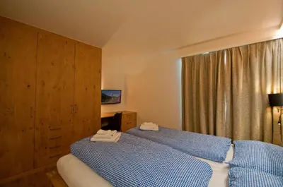 Ein Bett oder Betten in einem Zimmer der Unterkunft Haus Matten, Apartment Breithorn