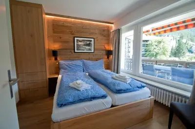 Ein Bett oder Betten in einem Zimmer der Unterkunft Haus Matten, Apartment Breithorn
