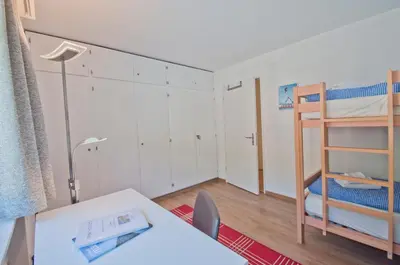 Ein Bett oder Betten in einem Zimmer der Unterkunft Haus Matten, Apartment Breithorn