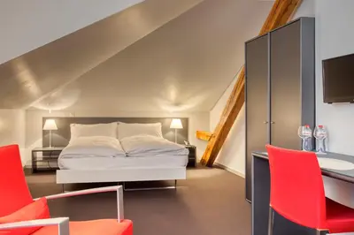 Ein Bett oder Betten in einem Zimmer der Unterkunft Hôtel Au Terminus